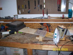 The fuselage side starts straight of course. But soon will bend. You start by soaking the area of the rear "dado" on both sides before placing it on the jig.