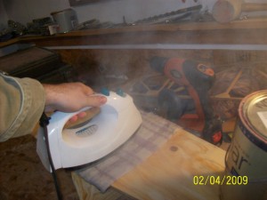 The next step is repeated steaming of the fuselage side. This is done by placing a soaked rag over the bend point and using an Iron with the thermostat turned up to "steam" and continually running it over the rag. KEEP THE RAG WET!!