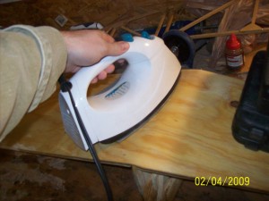 The last step is to run the hot iron over the fuselage for about 2 minutes to dry out the board a bit by sucking out some of that water that we soaked in.