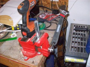 control linkage The control linkage is made up of small electrical conduit pieces that we smash in the bench vice. My cheap bench vice (from Harbor Freight) is a little small of the task.